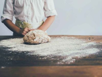 A bread baker enjoying The top 15 reasons to enjoy being a professional baker