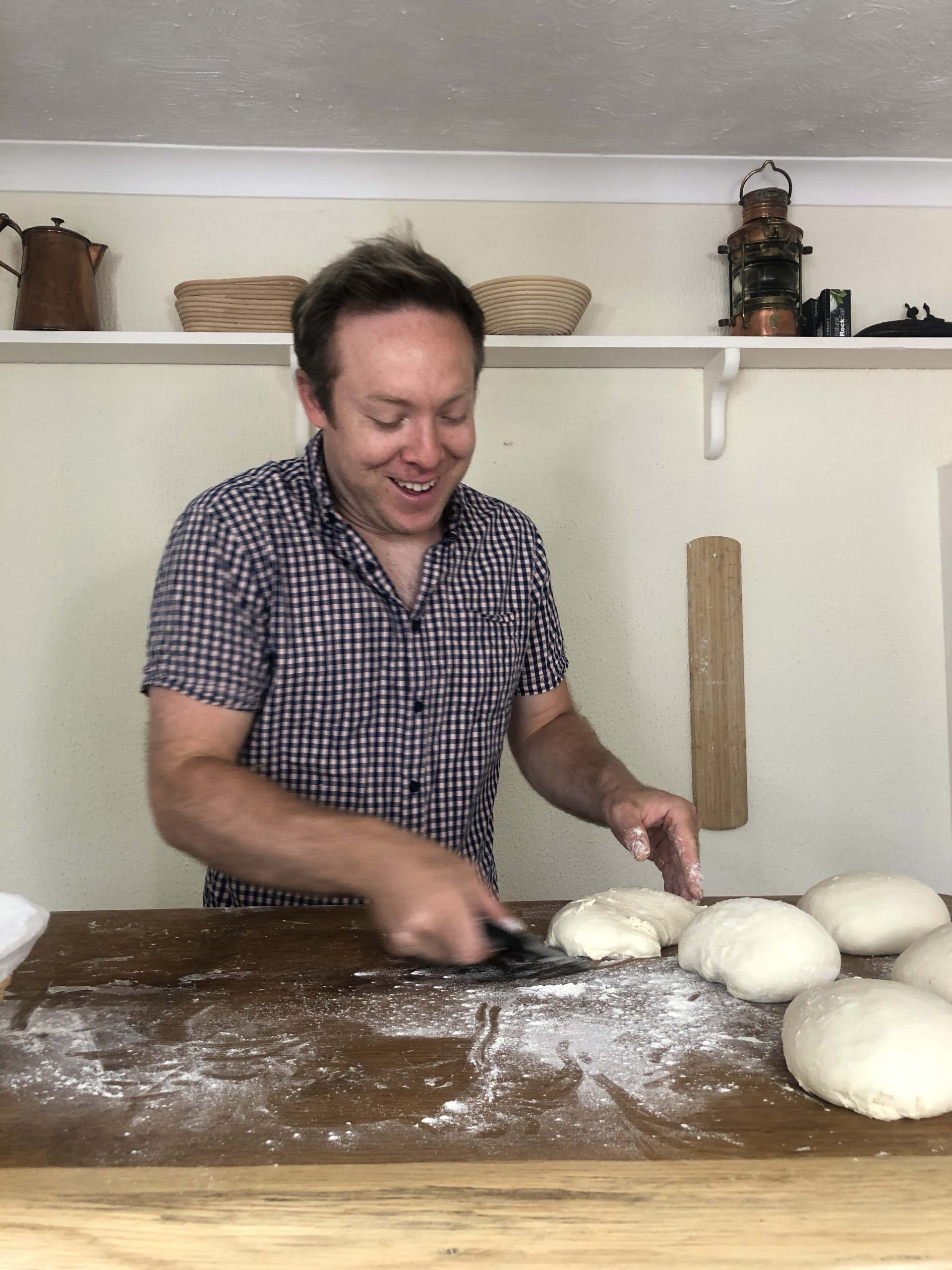 Gareth working with dough Professional baker working with dough on the table