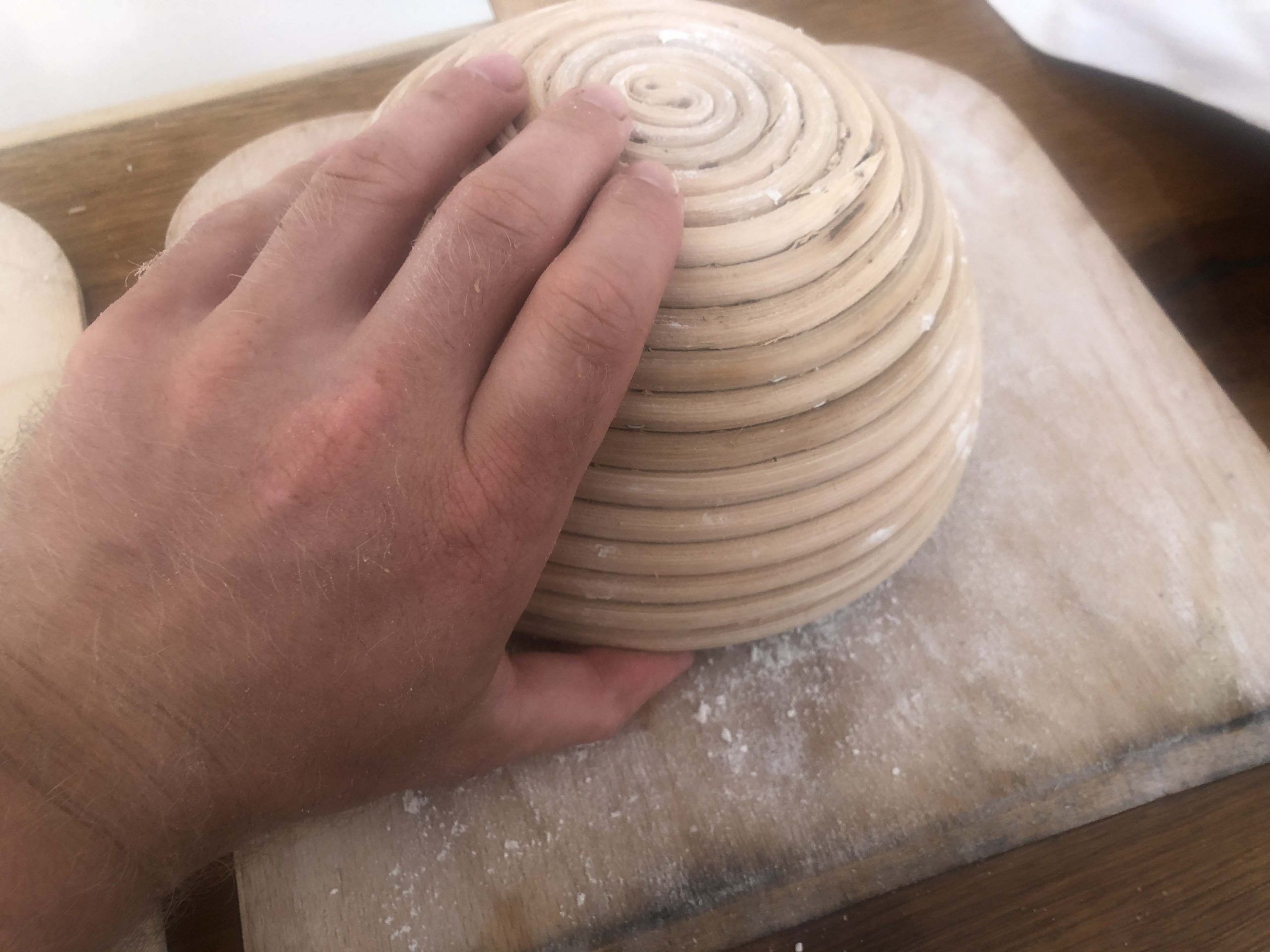 sourdough tipping sourdough out of the banneton