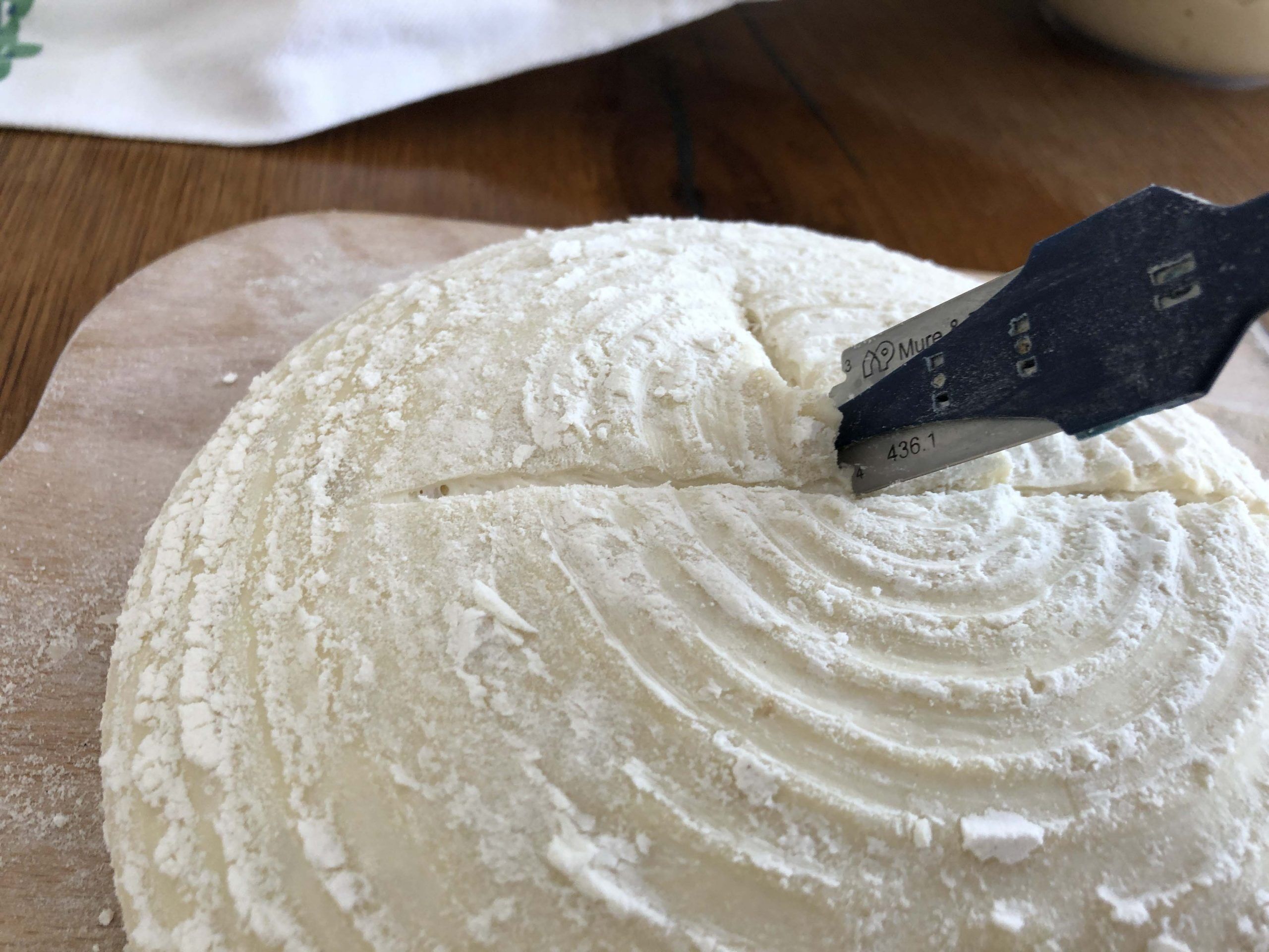 third cut of sourdough turn the dough 90 degrees and cut halfway