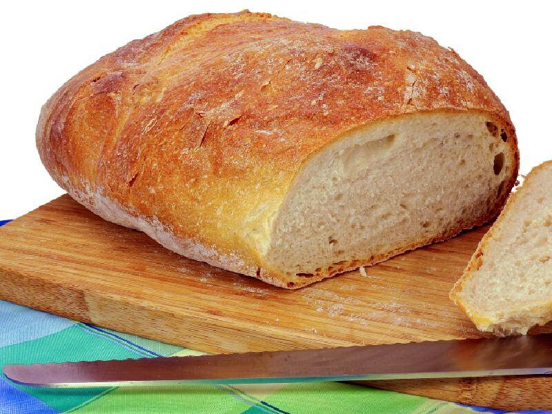 https://www.busbysbakery.com/wp-content/uploads/2021/06/cutting-sourdough-bread.jpeg